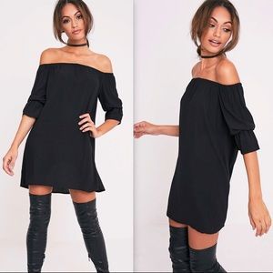 PrettyLittleThing Black Curved Hem Bardot Dress 0